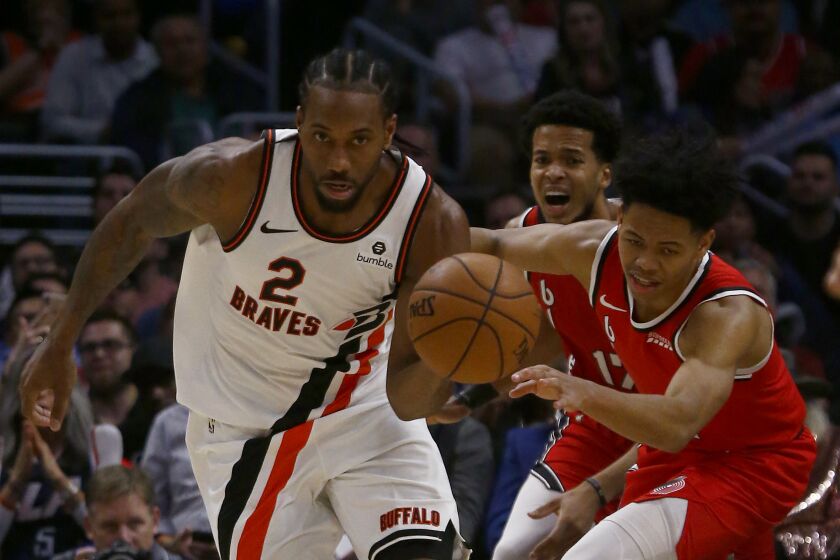 LOS ANGELES, CALIF. - NOV. 7, 2019. Clippers forward Kawhi Leonard steals the ball from Blazers guard Arnfernee Simons in the third quarter at Staples Center in Los Angeles on Wednesday night, Nov. 7, 2019. (Luis Sinco/Los Angeles Times)