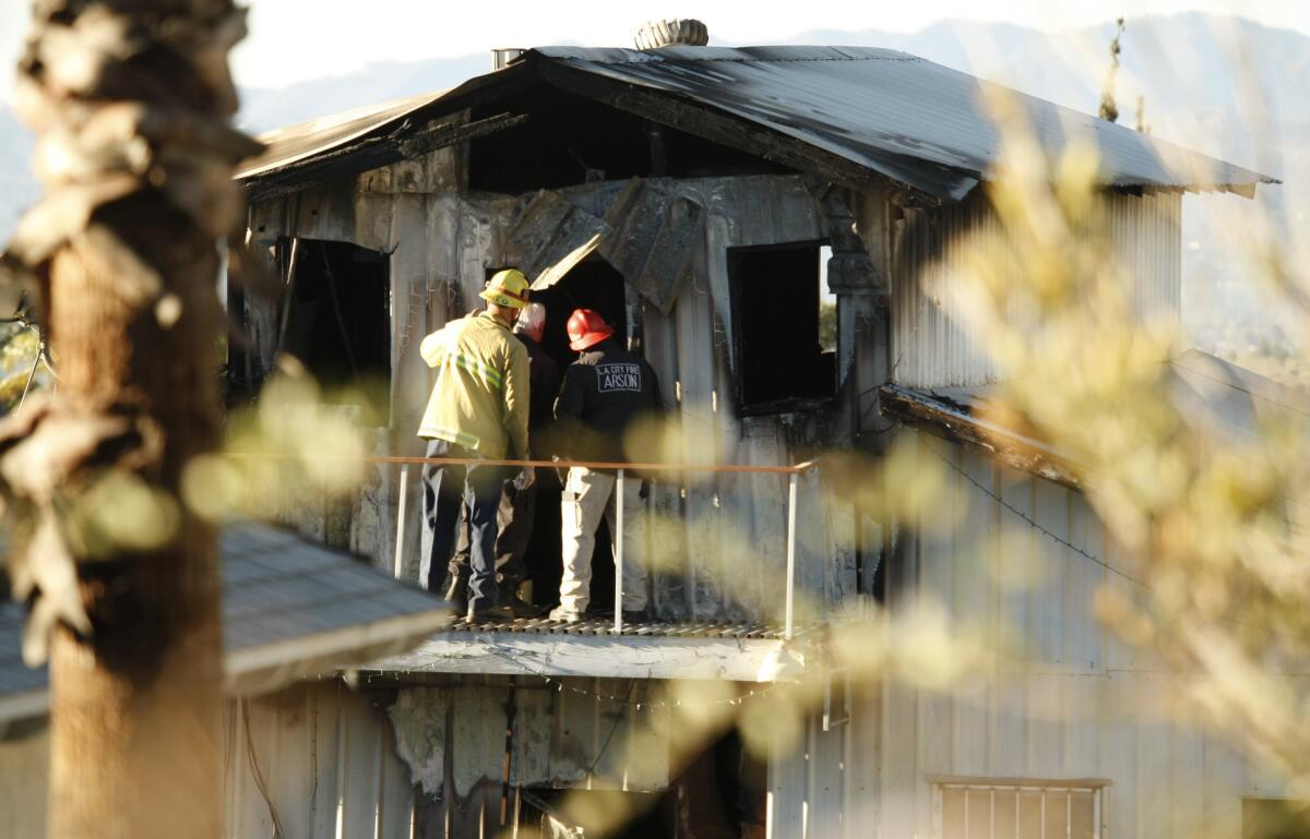 Fire investigators at the scene on the 13700 block of Eldridge Avenue in what was described as a two-story "metal-clad, barn-like home," said Brian Humphrey of the Los Angeles Fire Department.