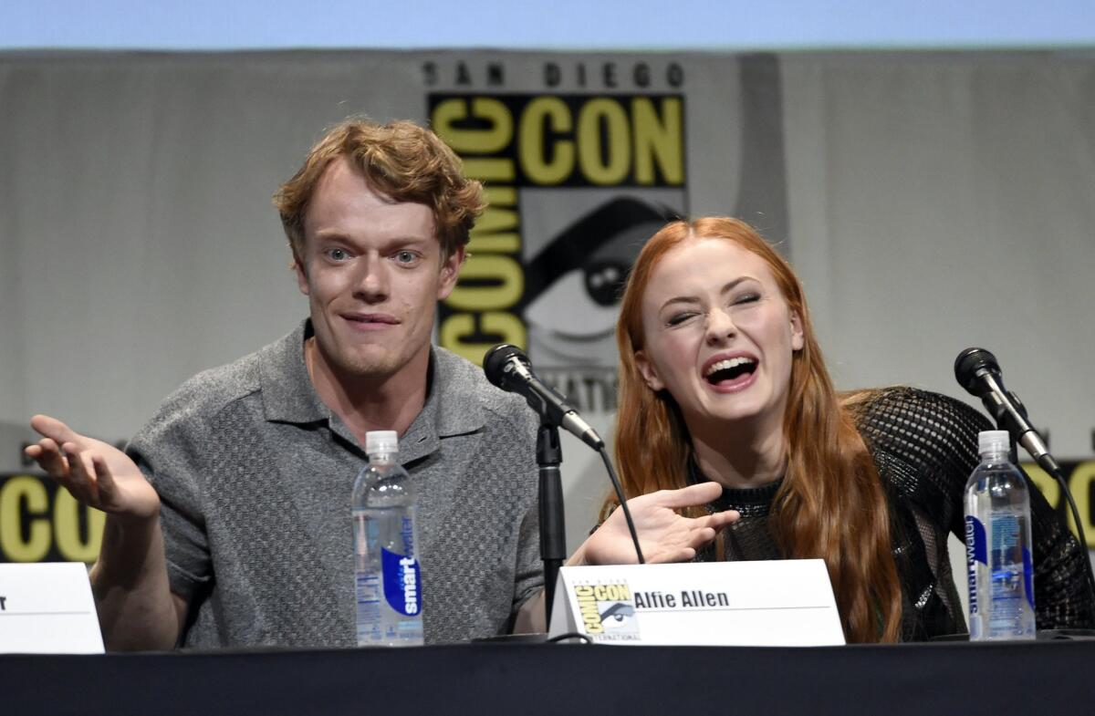 Alfie Allen and Sophie Turner at the "Game of Thrones" panel at Comic-Con International on July 10.