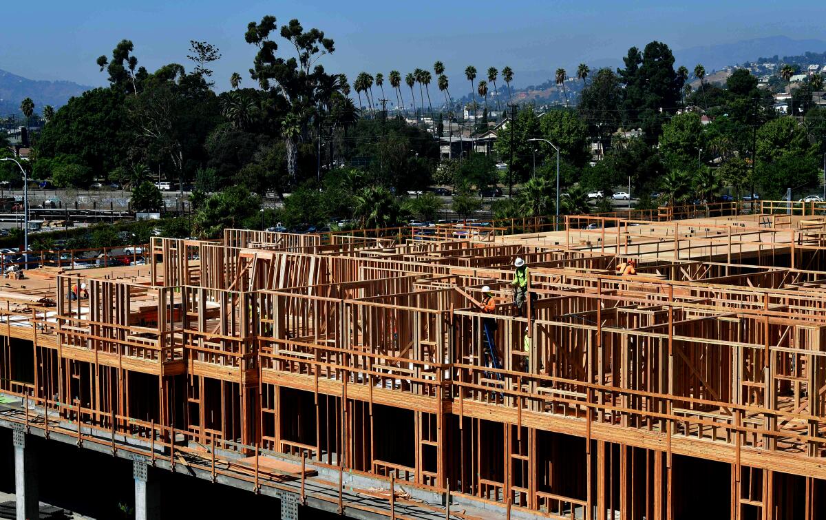 Construction workers working on the site of a new building in Los Angeles