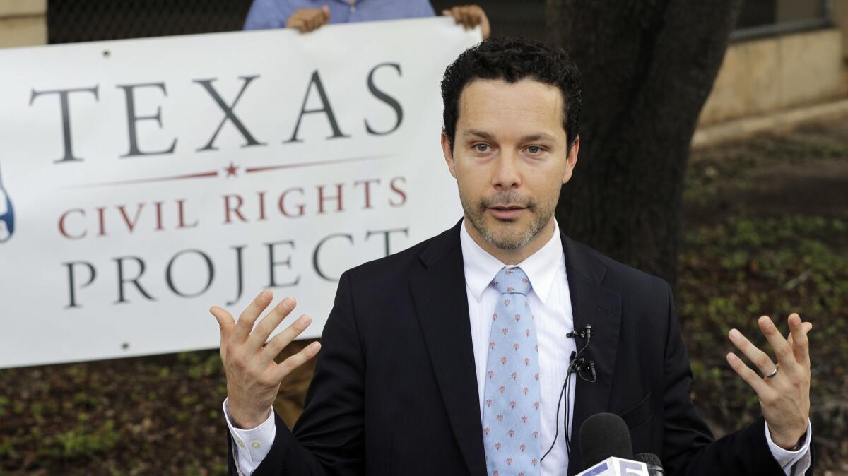 Immigration attorney Efren Olivares of the Texas Civil Rights Project at a news conference outside the McAllen courthouse.