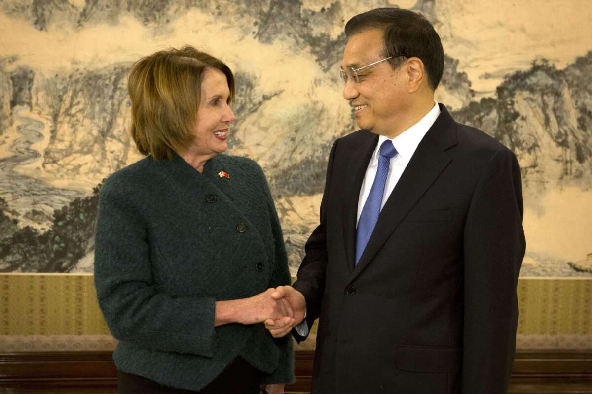 U.S. House Minority Leader Nancy Pelosi shakes hands with Chinese Premier Li Keqiang as she arrives for a bilateral meeting at the Zhongnanhai leadership compound in Beijing on Nov. 13, 2015. Pelosi and six other Congress members recently visited Tibet.