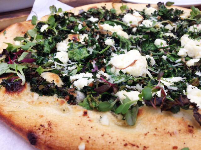 The new spinach and kale pizza with ricotta and a Parmesan cream sauce.