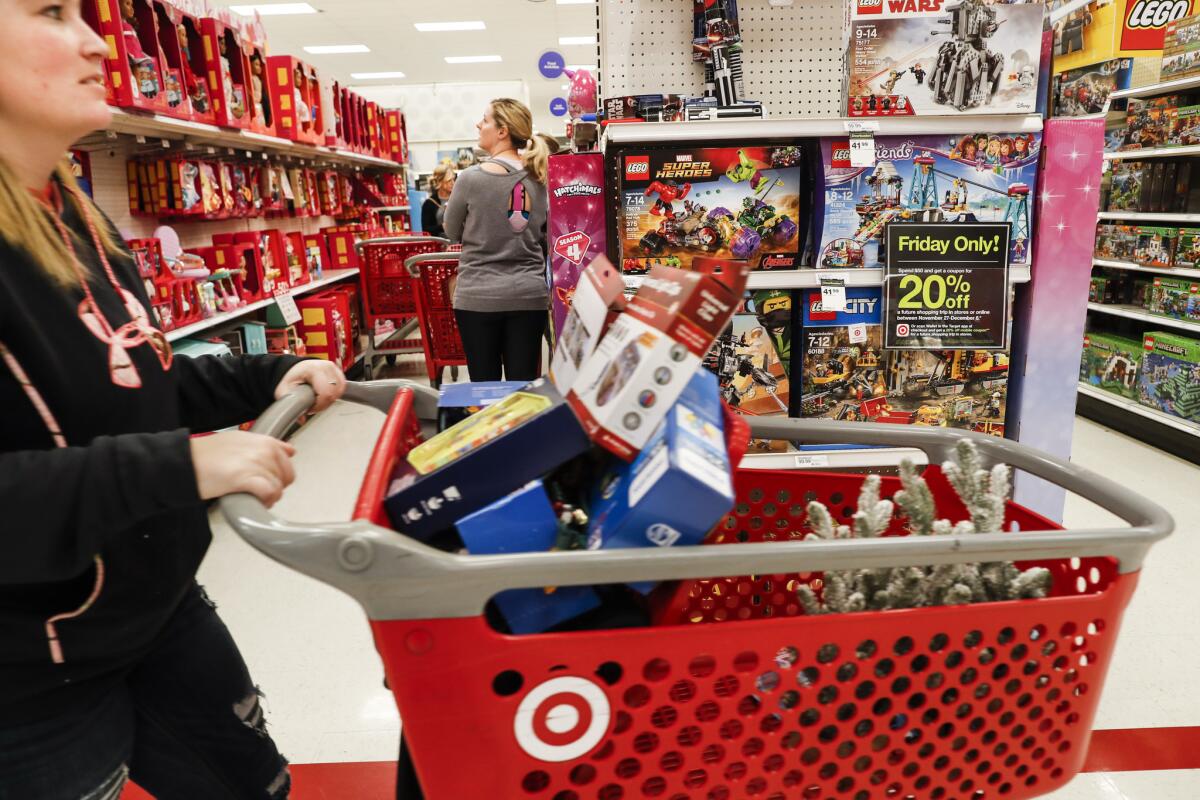 Shoppers browse the aisles during a Black Friday sale at a Target store in Newport, Ky.