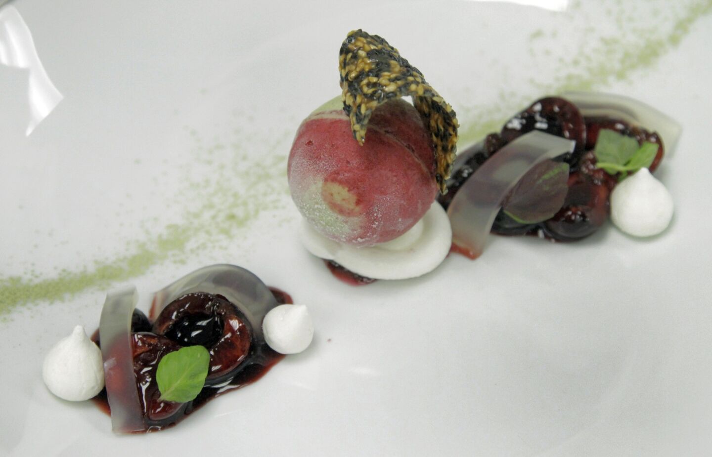 For dessert, Bing cherry sorbet, Matcha green tea ice cream, yuzu meringue and a black sesame crisp by Wolfgang Puck.