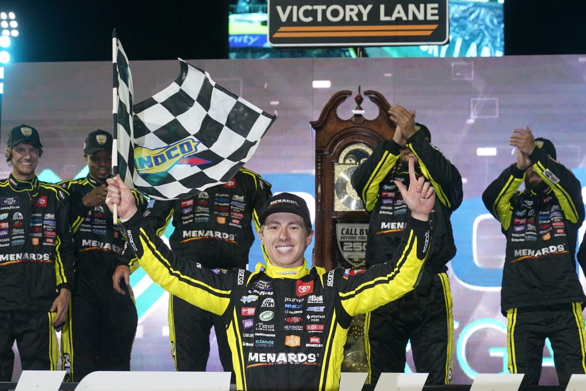 Brandon Jones celebrates after winning the NASCAR Xfinity Series auto race at Martinsville Speedway on Friday, April 8, 2022, in Martinsville, Va. (AP Photo/Steve Helber)