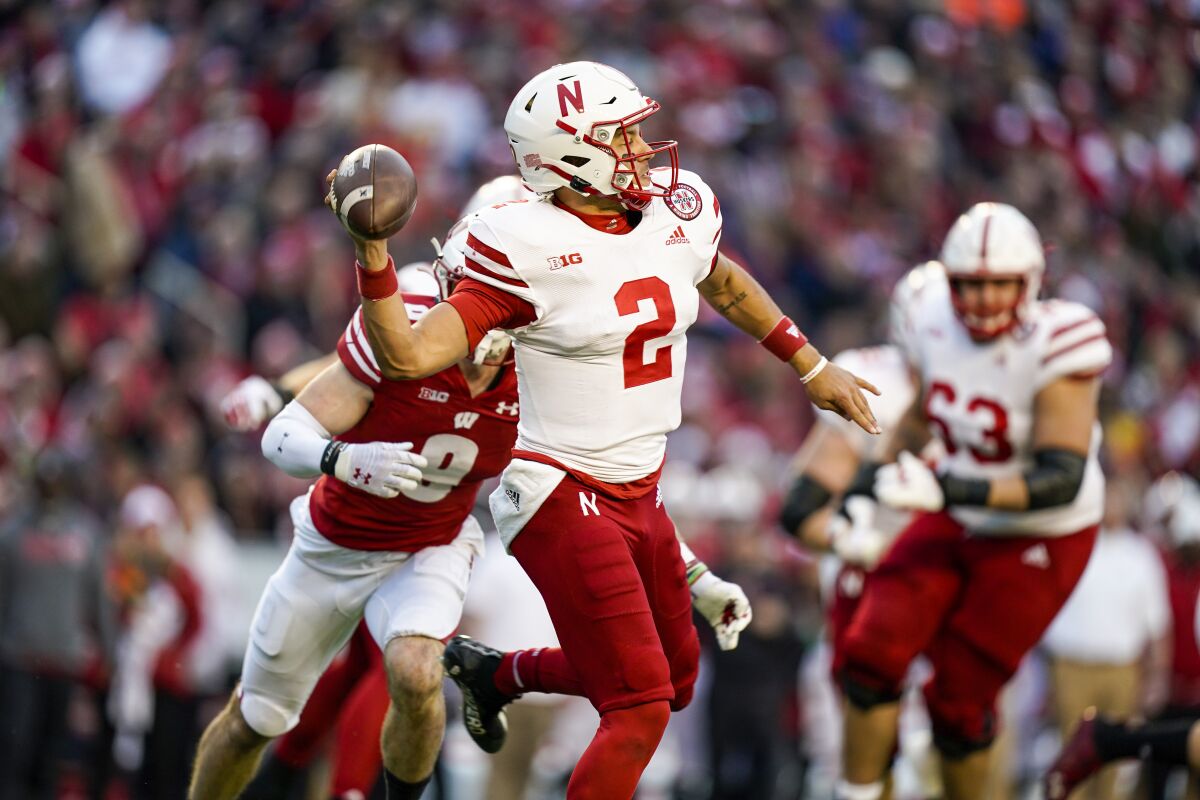Nebraska quarterback Adrian Martinez (2) looks to pass against Wisconsin during the first half of an NCAA college football game Saturday, Nov. 20, 2021, in Madison, Wis. (AP Photo/Andy Manis)