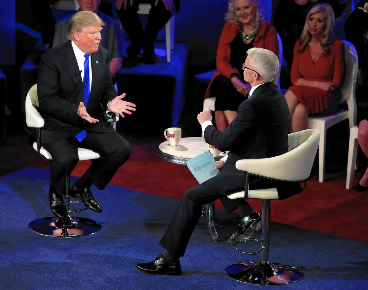 Donald Trump, left, appears with Anderson Cooper in a CNN town hall on Tuesday.