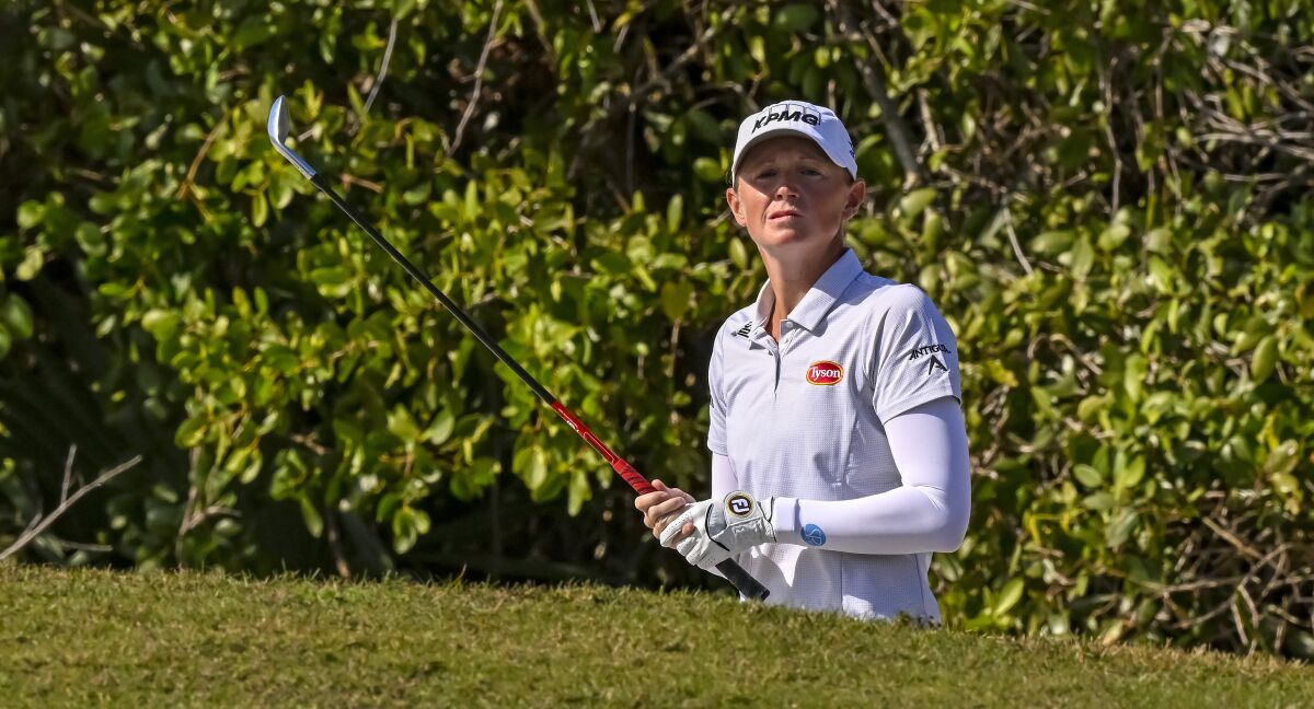 Stacy Lewis looks over the ninth green before hitting from a bunker during the second round of the LPGA Drive On Championship golf tournament at Crown Colony Golf & Country Club, Friday, Feb. 4, 2022, in Fort Myers, Fla. (AP Photo/Steve Nesius)