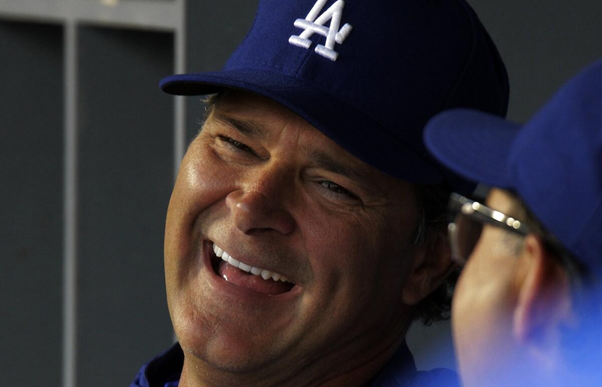 Don Mattingly and Trey Hillman chat before the game against the Arizona Diamondbacks at Dodger Stadium.