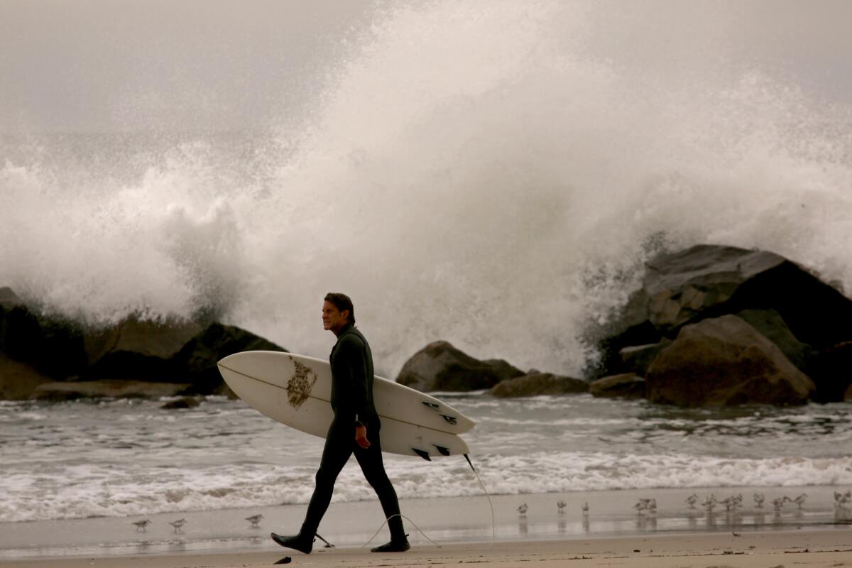 A surfer on the beach