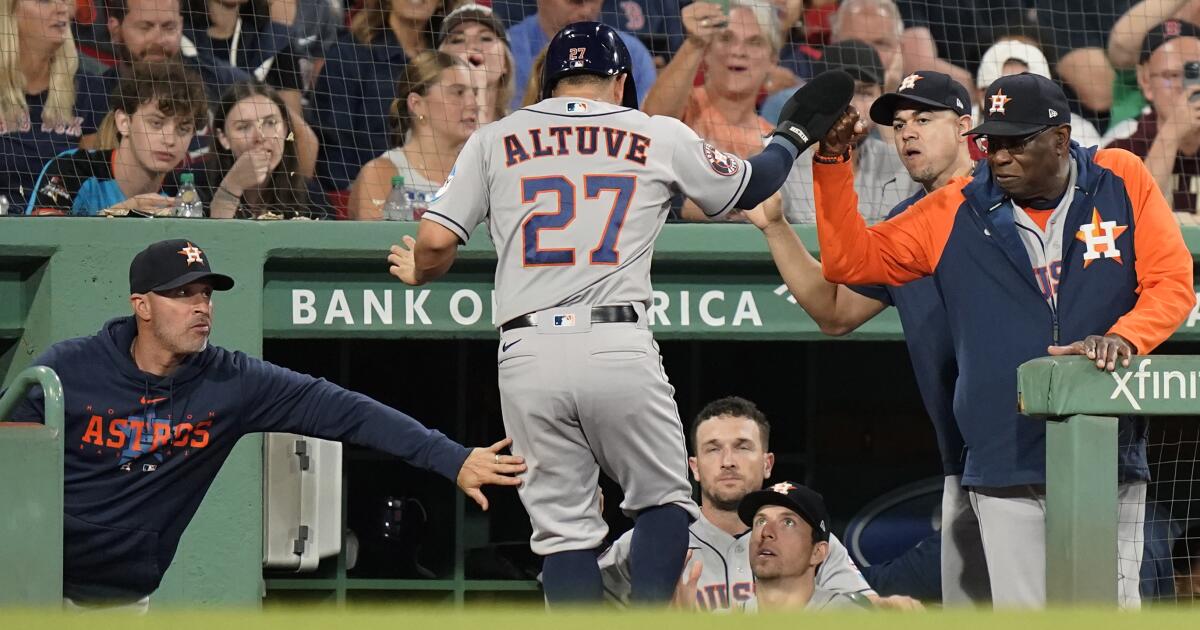 Jose Altuve of the Houston Astros sits in the dugout before the