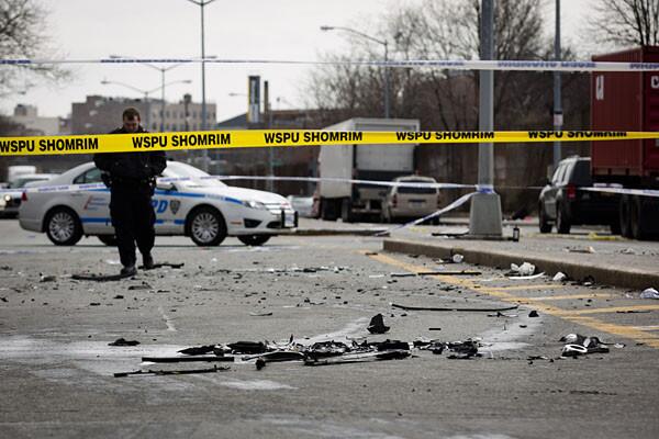 Debris from the accident litters Kent Avenue in Brooklyn.