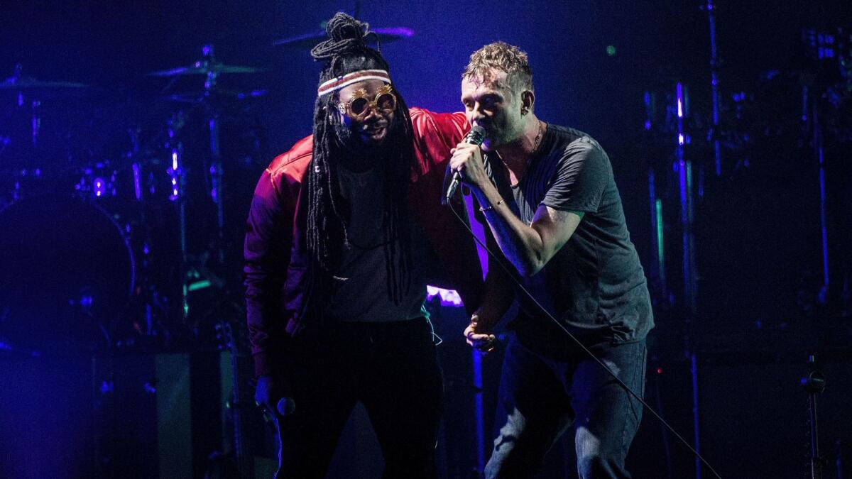 D.R.A.M., left, and Damon Albarn perform with Gorillaz on Thursday night at the Forum.