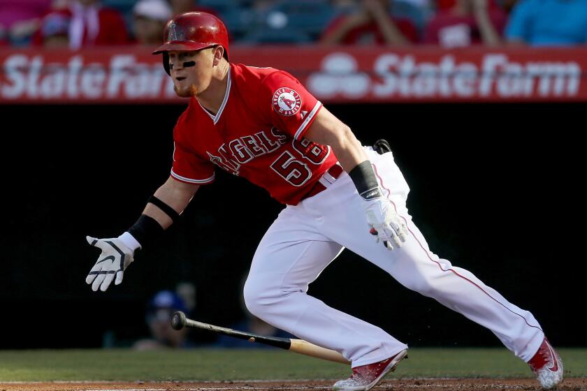 Angels right fielder Kole Calhoun bats against the Athletics during a game at Angel Stadium on Sept. 30.