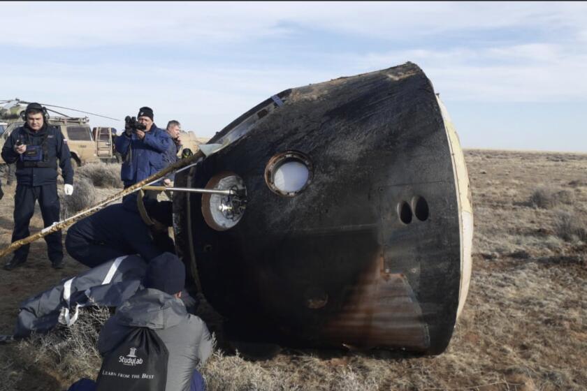 In this photo released by Roscosmos Space Agency, the Russian Soyuz MS-19 space capsule lies on the ground shortly after the landing southeast of the Kazakh town of Zhezkazgan, Kazakhstan, Wednesday, March 30, 2022. The Soyuz MS-19 capsule landed upright in the steppes of Kazakhstan on Wednesday with NASA astronaut Mark Vande Hei, Russian Roscosmos cosmonauts Anton Shkaplerov and Pyotr Dubrov. (Alexander Pantiukhin, Roscosmos Space Agency via AP)