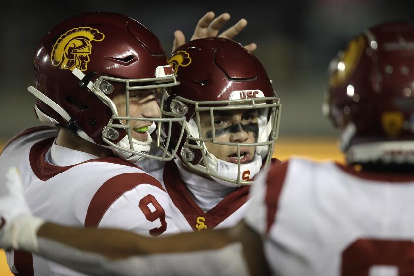 Southern California quarterback Kedon Slovis (9) celebrates with Drake London after London's touchdown against California in the second half of an NCAA college football game Saturday, Nov. 16, 2019, in Berkeley, Calif. (AP Photo/Ben Margot)