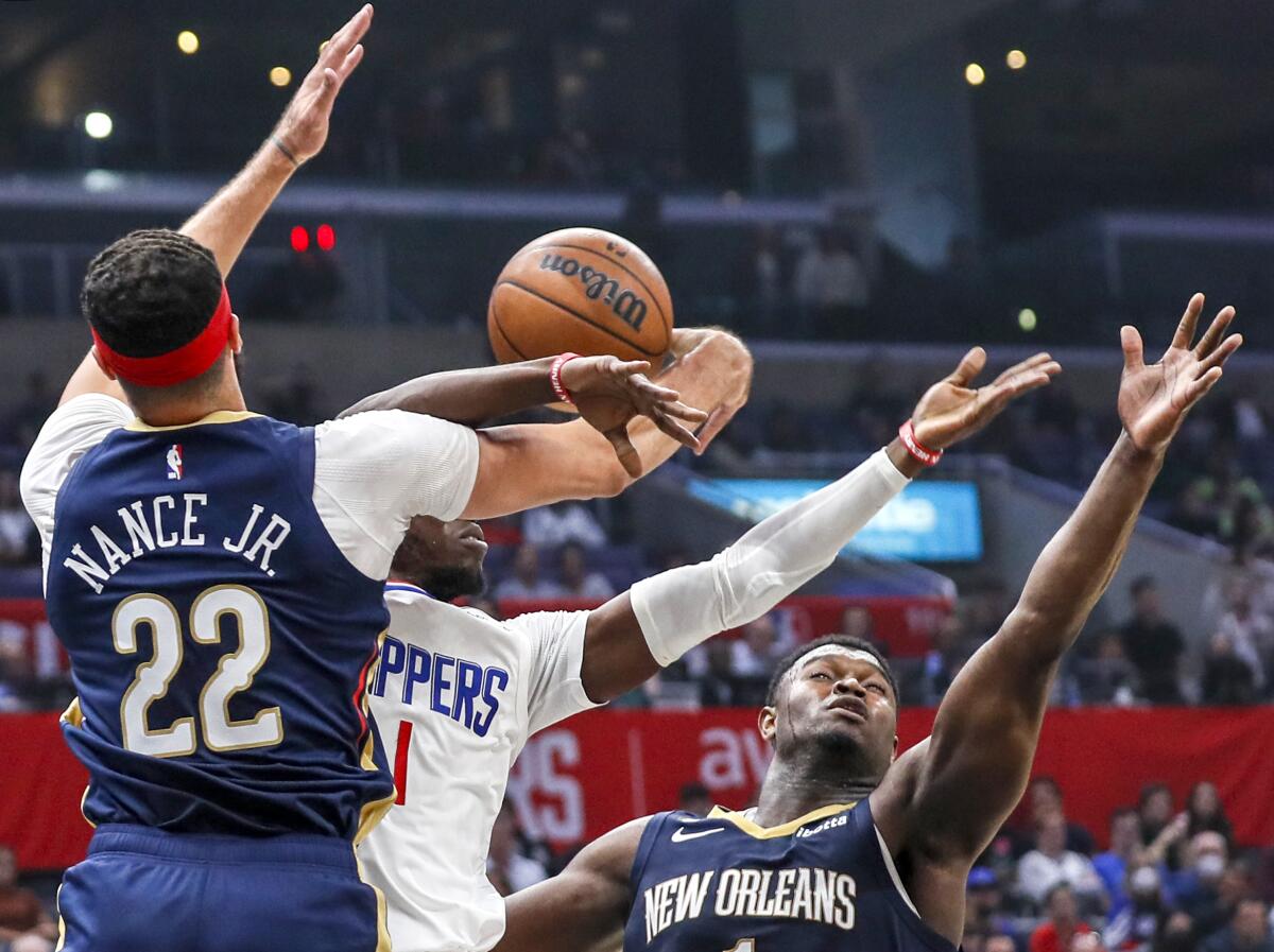 Clippers guard Reggie Jackson (1) is stripped of the ball by Pelicans forward Larry Nance Jr.