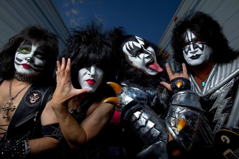 Kiss members Eric Singer, left, Paul Stanley, Gene Simmons and Tommy Thayer in 2014.