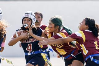 Garfield' Evanie Macias runs with the ball under pressure from Roosevelt's Katie Molina and Brandy Escobar last season 