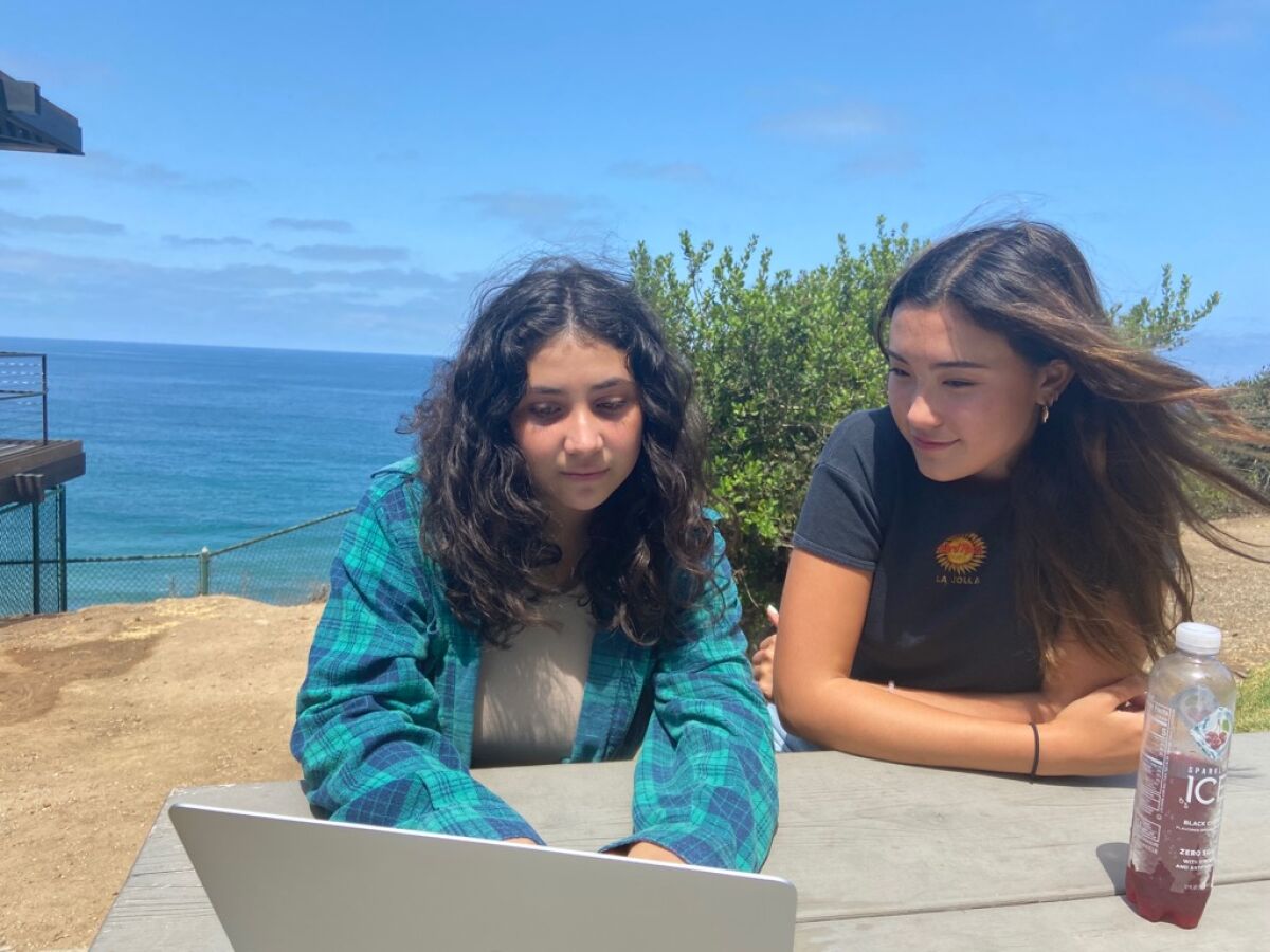 La Jolla High students Priscilla Rayon and Crescent Norman do online research as part of the Social Media Justice League.