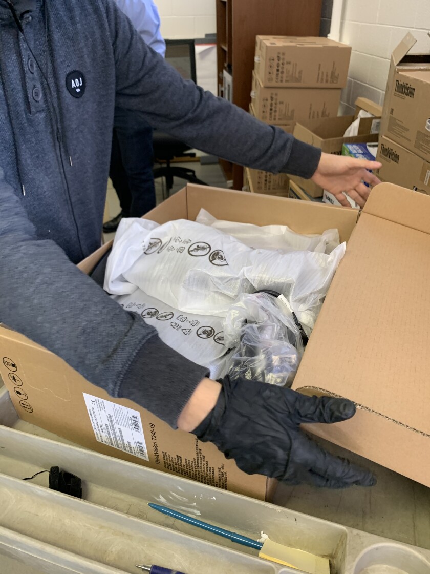 Workers from T2 Tech Group recently cleaned and shipped 70 computers for donation