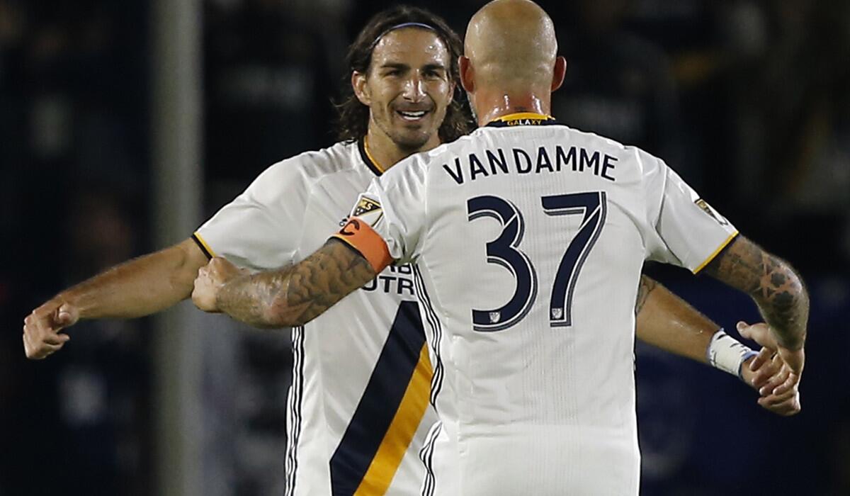 Alan Gordon, left, is congratulated by Galaxy teammate Jelle Van Damme after scoring against Real Salt Lake on Oct. 26.