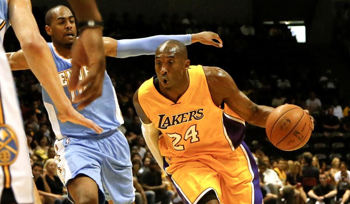 Lakers guard Kobe Bryant drives past Nuggets guard Arron Afflalo during a preseason game last month.