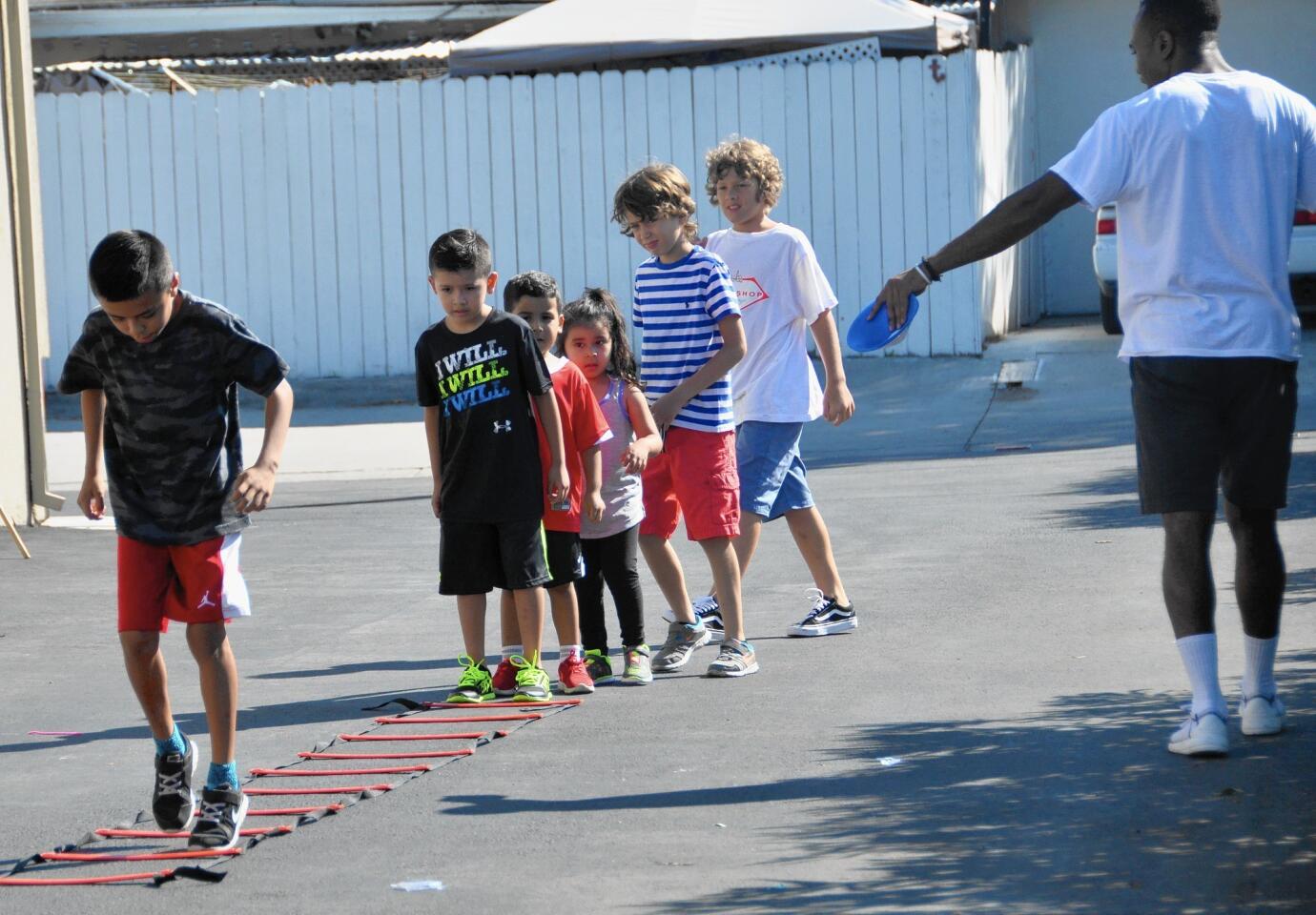 From left, students Nelson, Armani, Damien, Arlene, Gabriel and Elliot have a lesson in developing coordination skills.
