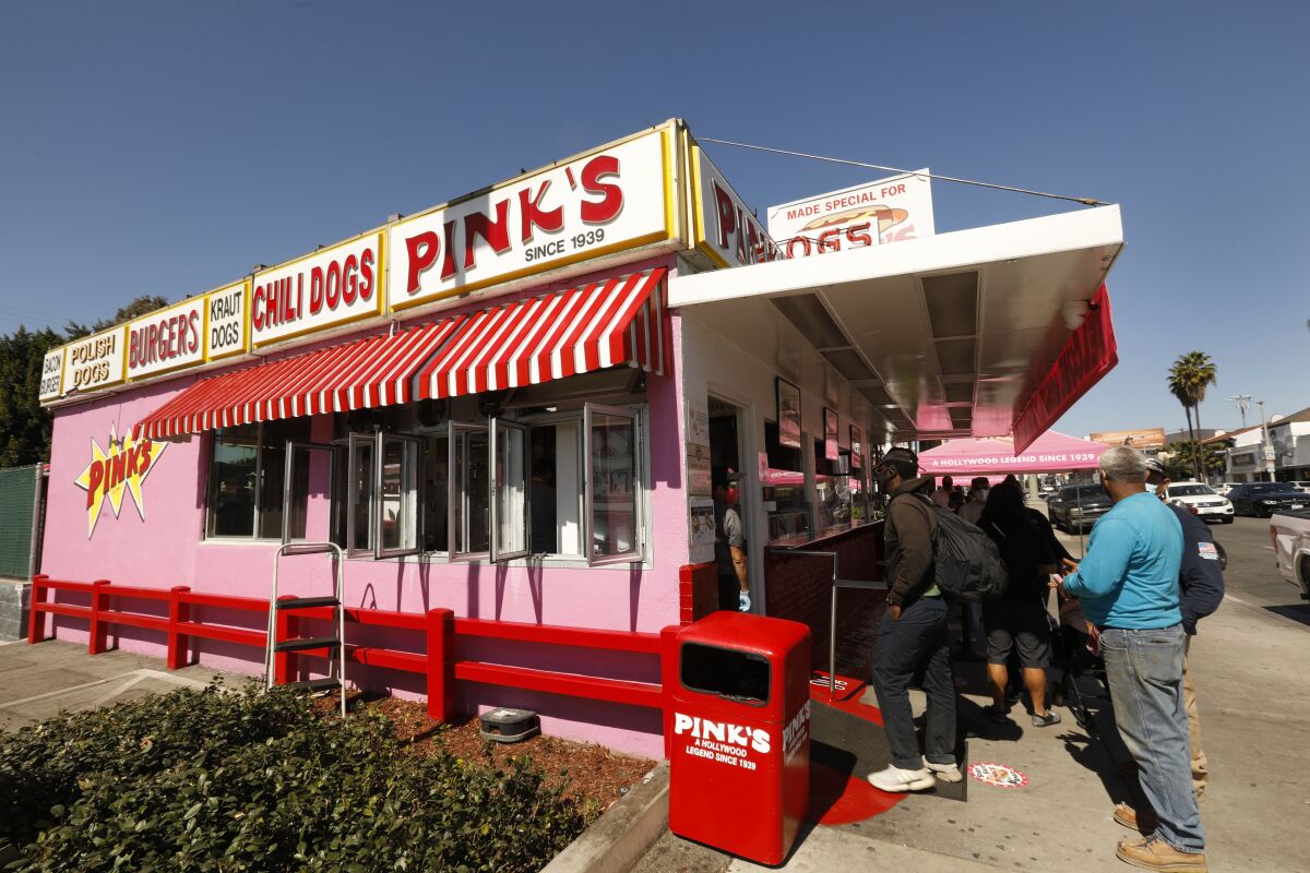 People line up outside Pink's Hot Dogs