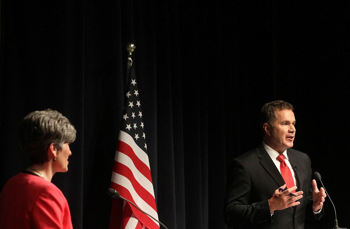 Republican state Sen. Joni Ernst, left, and Democratic U.S. Rep. Bruce Braley debate in Davenport, Iowa, on Oct. 10 in the U.S. Senate race in the state.