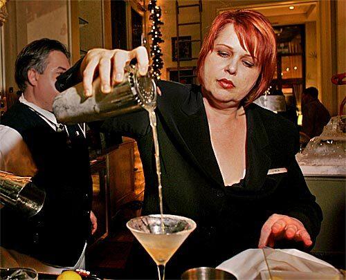 Lu Brow demonstrates the art of pouring a Side Car at Café Adelaide in the Loews New Orleans Hotel.