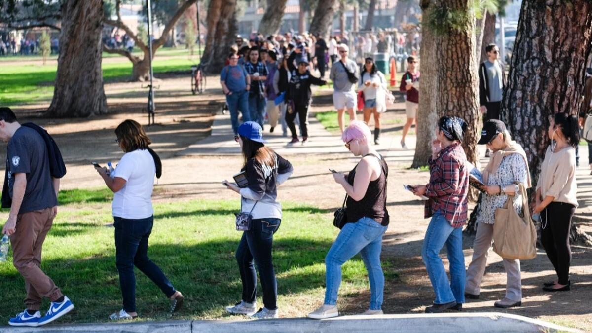 Angelenos line up at the North Hollywood polling station Sunday to cast their ballots ahead of Tuesday's election.