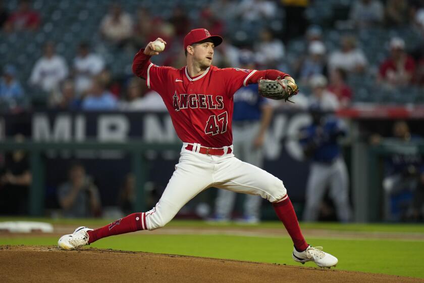 ANAHEIM, CA - OCTOBER 01: Los Angeles Angels Shohei Ohtani (17) holds the  2022 Nick Adenhart Award and team MVP Award on the field while team General  Manager Perry Minasian, team owner