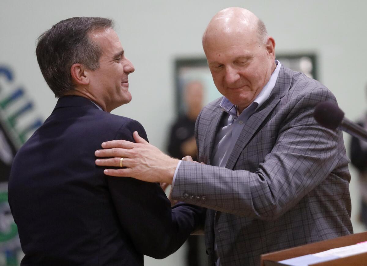 L.A. Mayor Eric Garcetti greets Clippers owner Steve Ballmer.