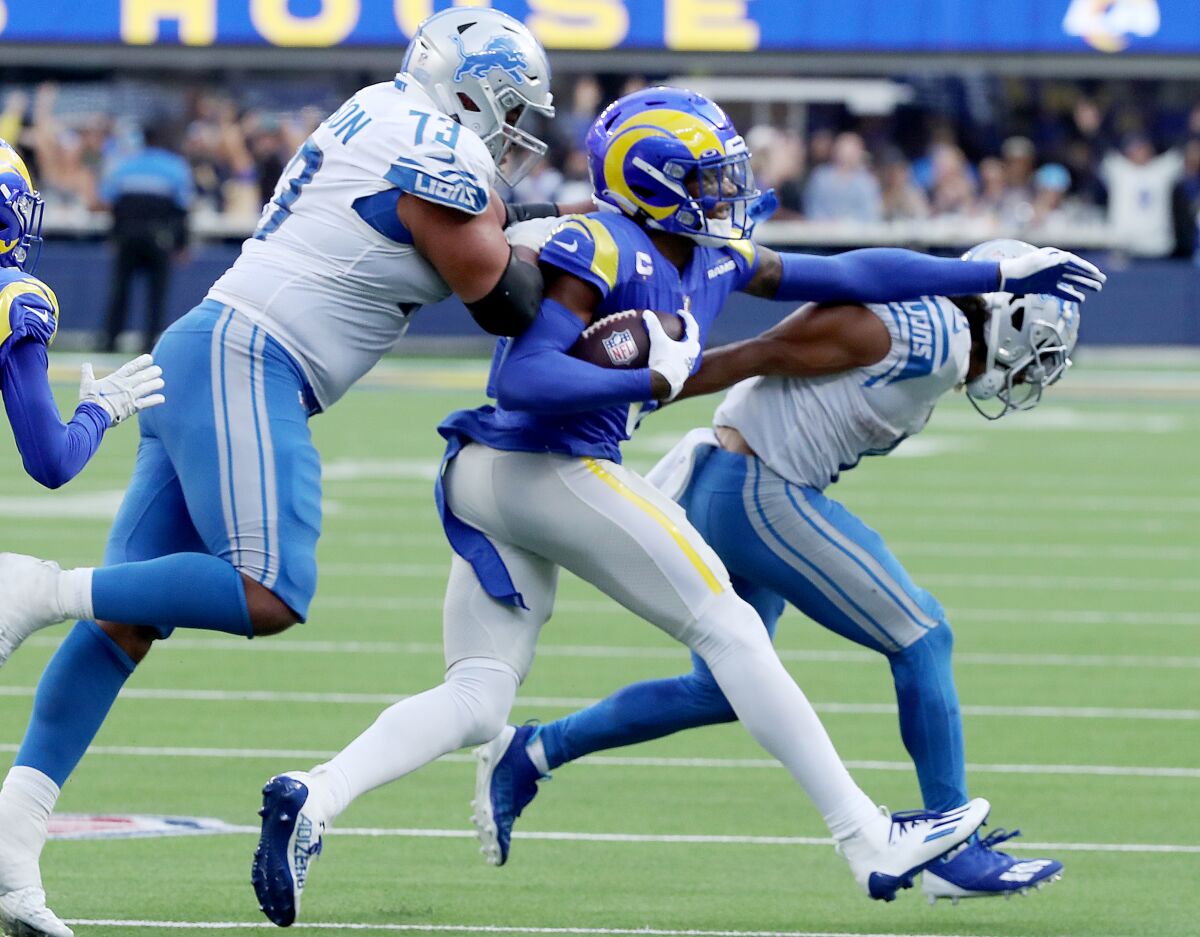 Rams cornerback Jalen Ramsey returns an interception of a pass by Lions quarterback Jared Goff in the fourth quarter.