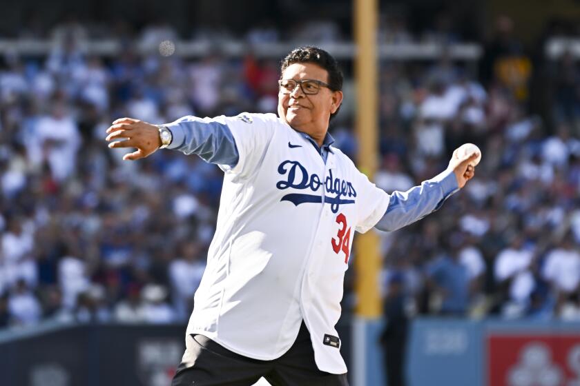 LOS ANGELES, CA - JULY 19: Fernando Valenzuela throws out the ceremonial first pitch.