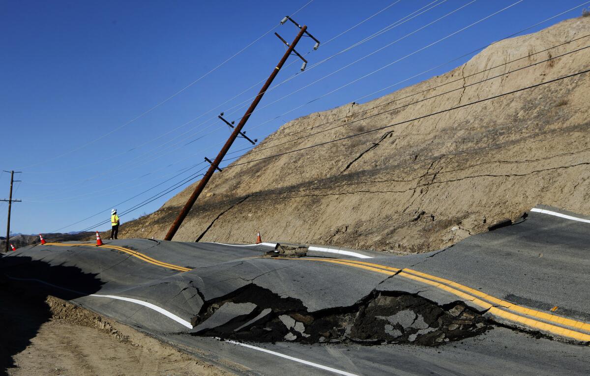 A more than 2-mile stretch of road remained closed in the Canyon County area Friday as investigators tried to determine why the road buckled and continued to rise, according to the L.A. County Department of Public Works.