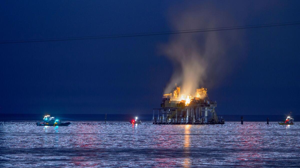 Authorities respond to an oil rig explosion on Lake Pontchartrain off Kenner, La., on Sunday.