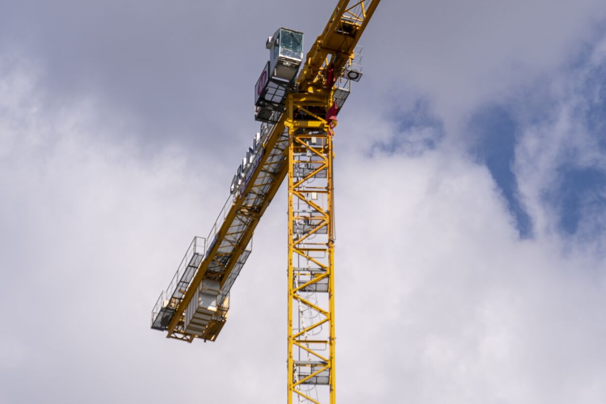 A construction crane that was climbed by a father of a Parkland shooting victim at 15th Street and Pennsylvania Avenue in Northwest across the street from the White House, in Washington, Monday, Feb. 14, 2022. (AP Photo/Andrew Harnik)