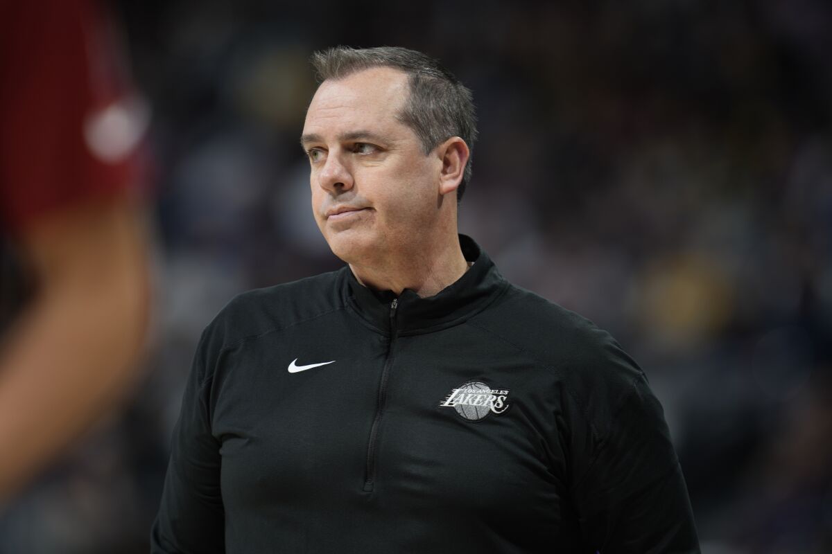Lakers coach Frank Vogel watches from the sideline during the first half of the team's 146-141 overtime win.