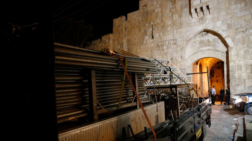 A truck removes barriers from the Al Aqsa Mosque in Jerusalem.