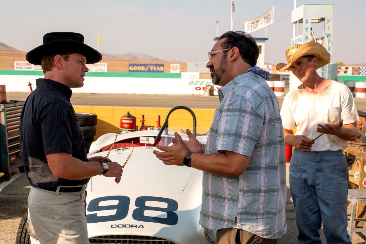 Matt Damon and Christian Bale with direcor James Mangold on the "Ford v Ferrari" set.