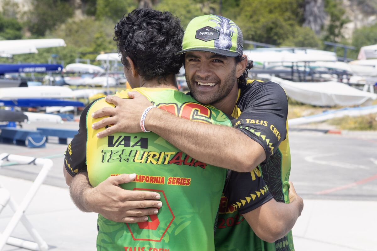 From right, Steeve Teihotaata and his brother, Kevin Kouider, embrace after finishing Va’a California Series race.