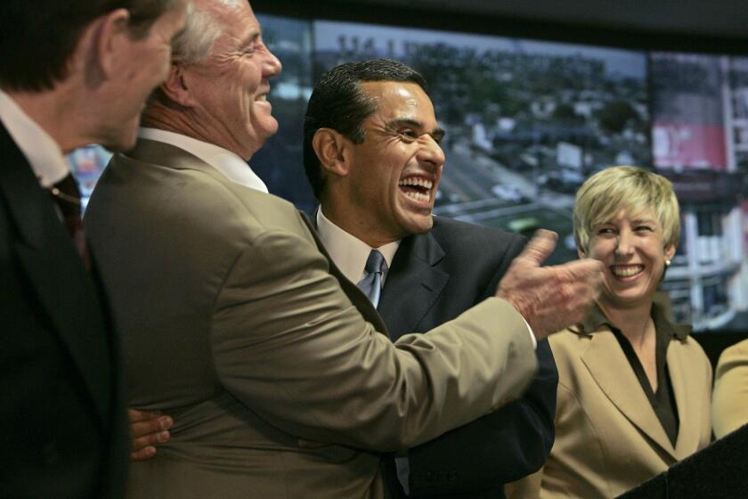 File photo shows Antonio Villaraigosa, center and Wendy Greuel, right.