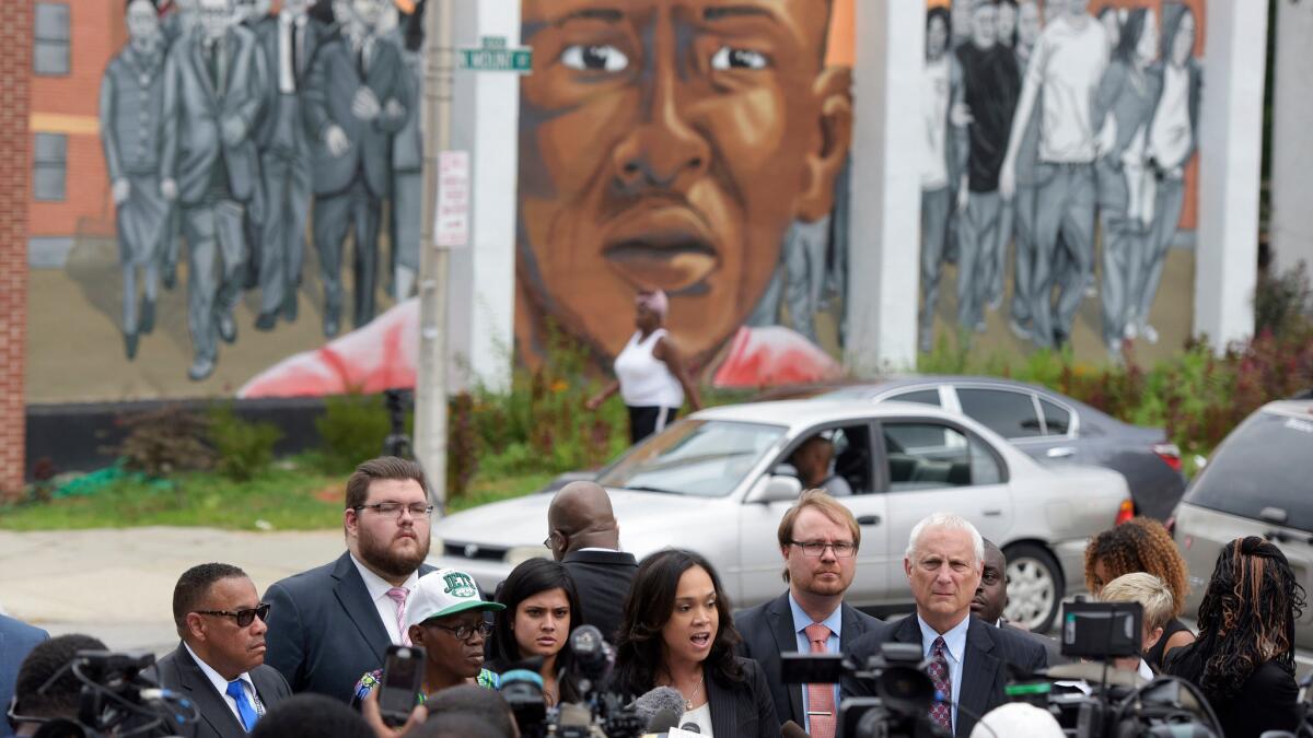 Standing in front of a mural depicting Freddie Gray on July 27, Baltimore State’s Atty. Marilyn Mosby announces that her office will drop the remaining charges against three Baltimore police officers awaiting trial in Gray’s death.