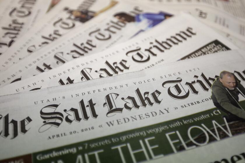 FILE - Copies of The Salt Lake Tribune newspaper are shown on April 20, 2016, 2020, in Salt Lake City. The Salt Lake Tribune will stop printing a daily newspaper after nearly 150 years at the end of the year and move to a weekly print edition. The newspaper reported Monday, Oct. 26, 2020, the change won't result in cuts to the newsroom staff, but nearly 160 people involved with printing and delivering the daily paper will be laid off. (AP Photo/Rick Bowmer, File)