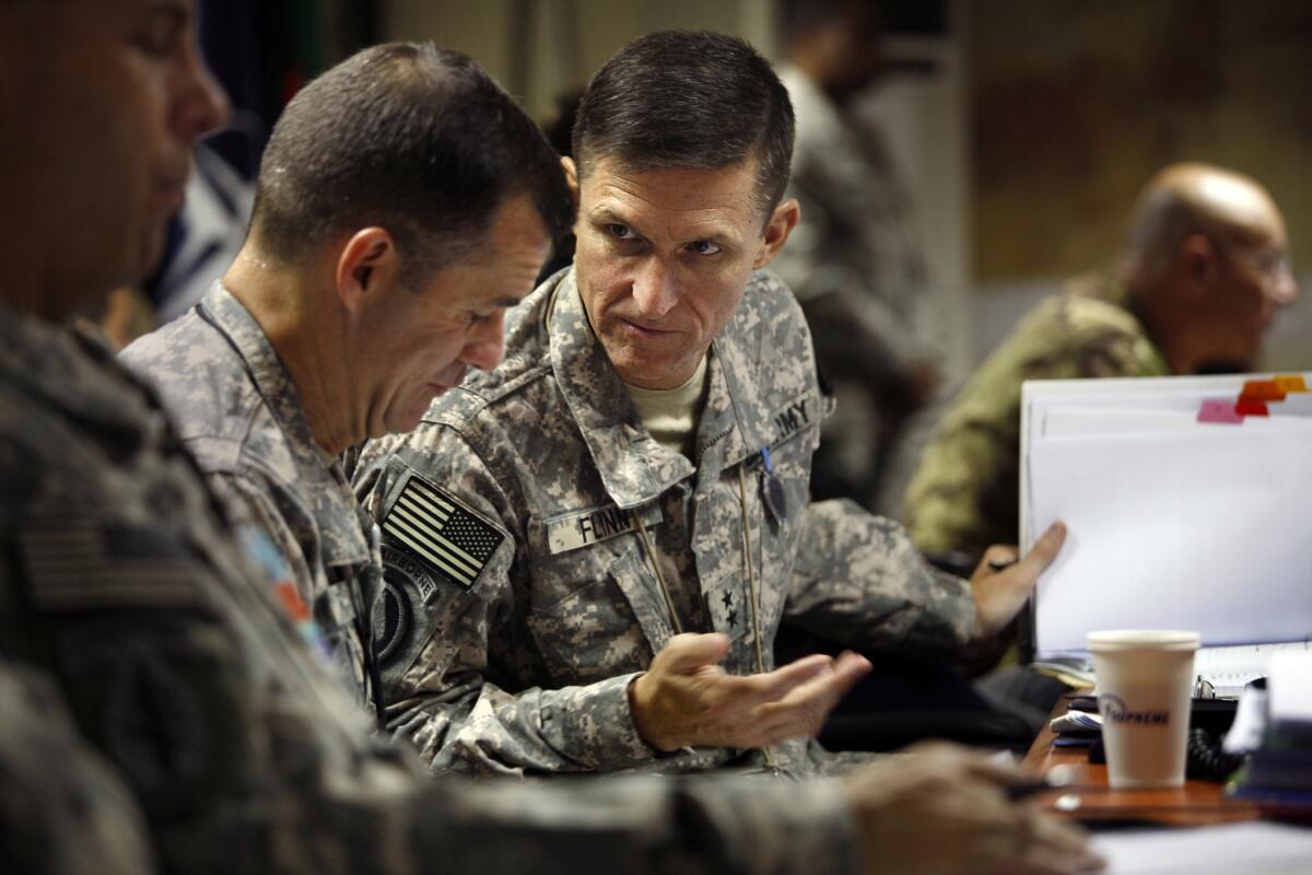 Maj. Gen. Michael T. Flynn, director of intelligence in Afghanistan, confers with his brother Col. Charlie Flynn, left, an aide to Gen. Stanley A. McChrystal, the U.S. and allied commander in Afghanistan.