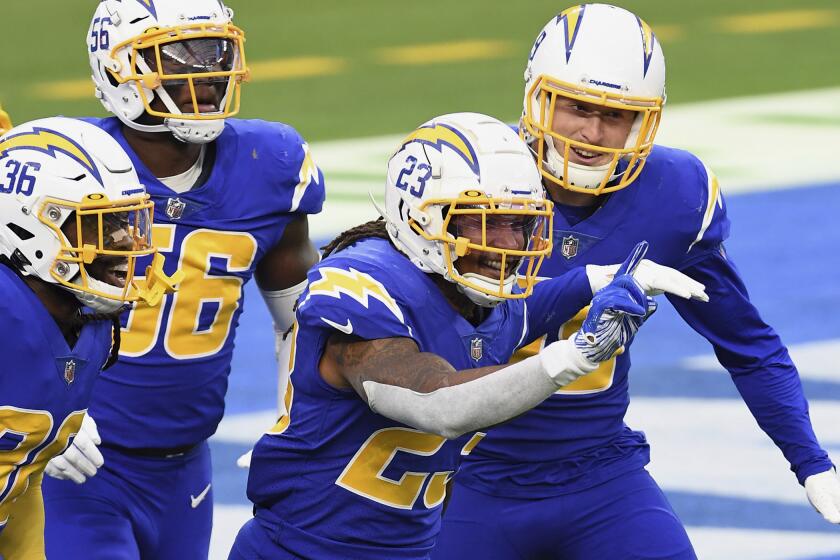 Los Angeles Chargers safety Rayshawn Jenkins (23) reacts with his teammates after Jenkins intercepted a pass.