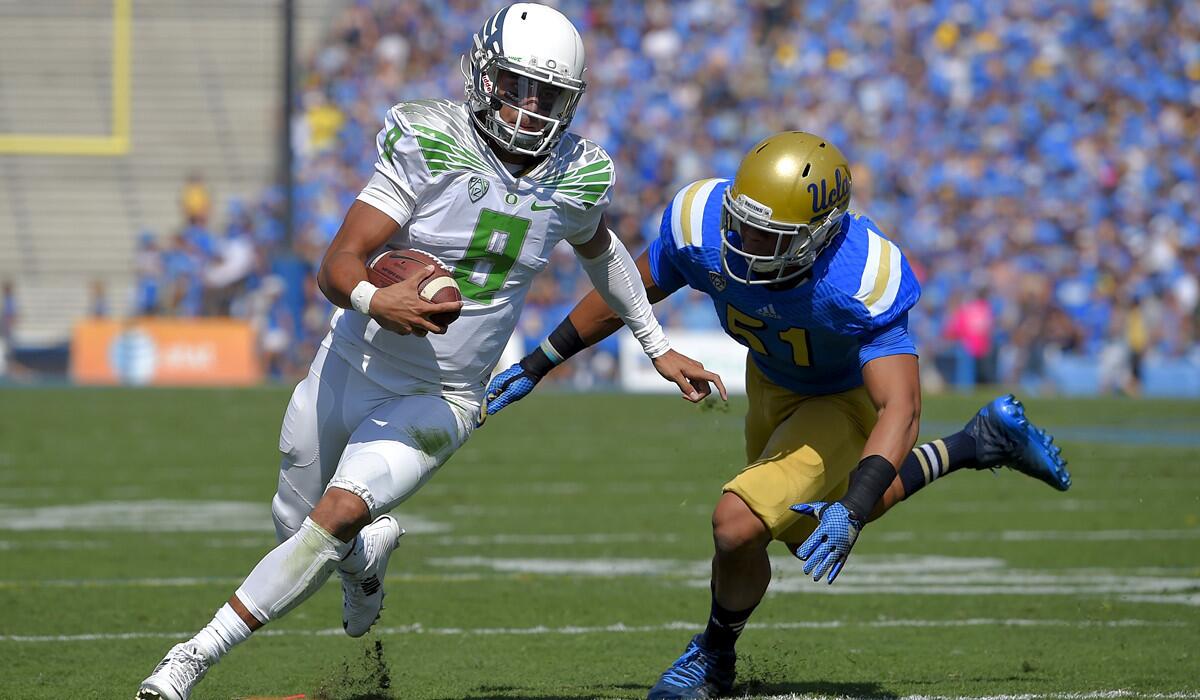 Quarterback Marcus Mariota (8) and one-loss Oregon have a chance to make the four-team College Football Playoff, but linebacker Aaron Wallace and two-loss UCLA can forget about it.